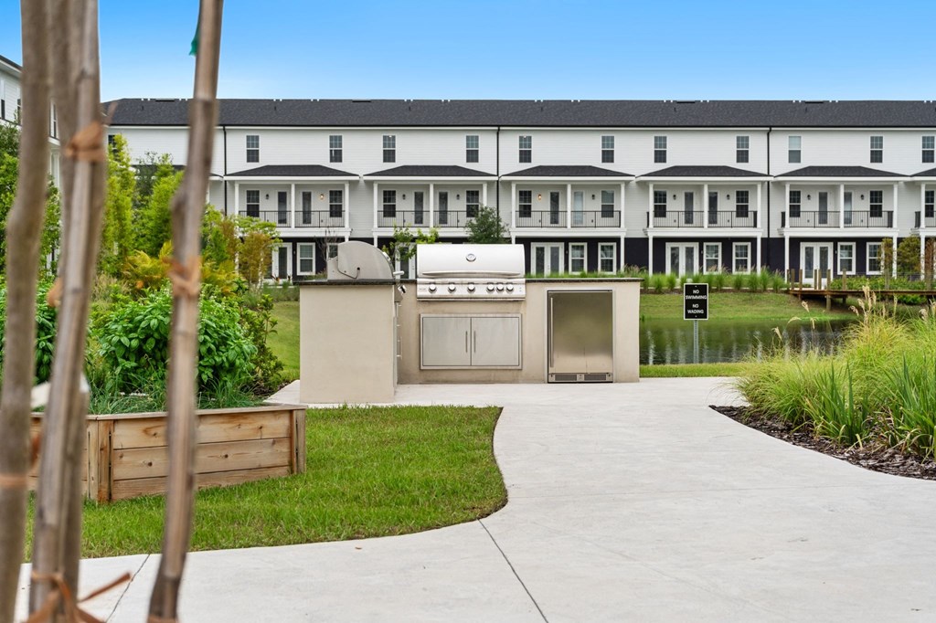 a kitchen with a grill in front of a building