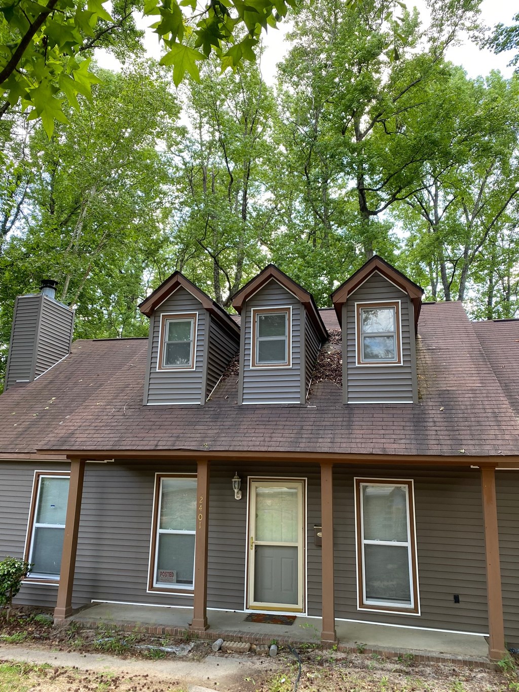 three dormers on the roof of a house