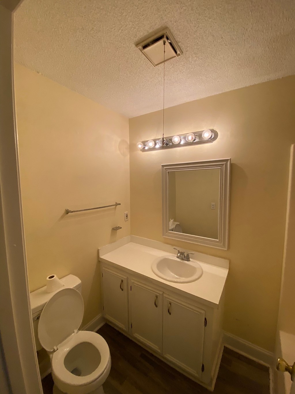 a small bathroom with a sink toilet and mirror