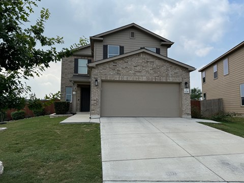 a house with a driveway and a garage door