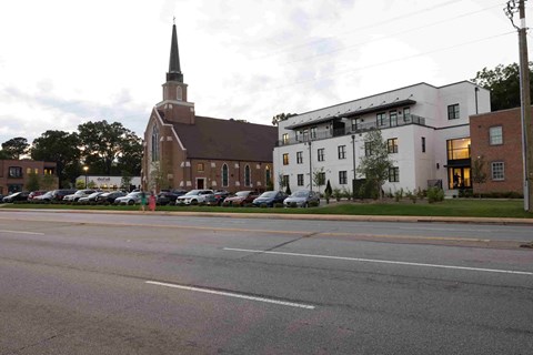 a church and a building on the side of a street