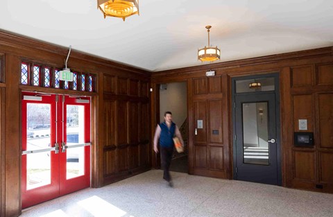 a person walking through a lobby of a building