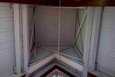 the inside of a church steeple with a stained glass window
