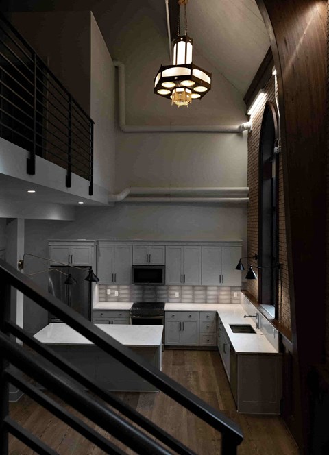 a view of a kitchen from the staircase