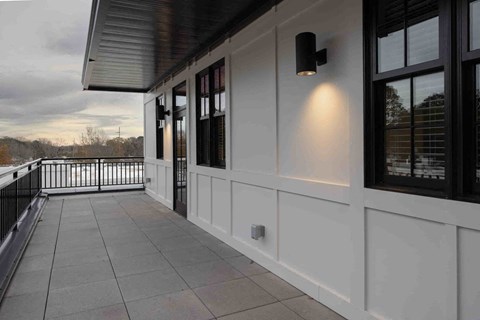 a covered porch with a view of the river