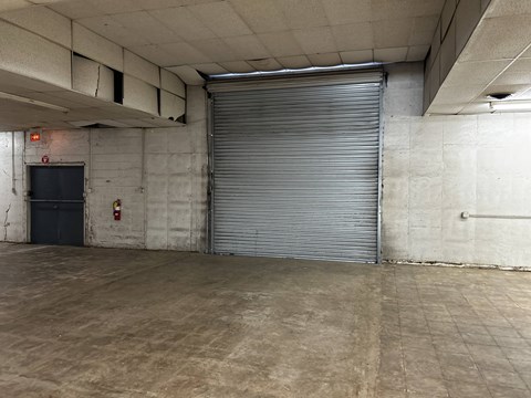 a large roll up door in a large room