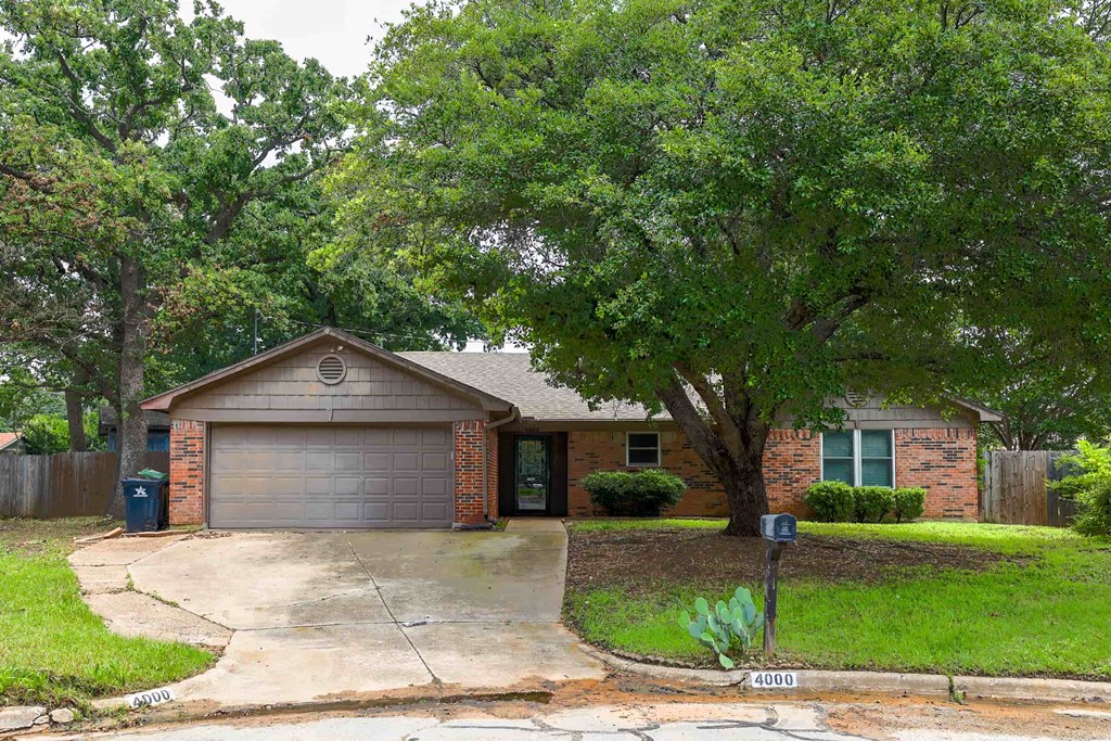 a house with a driveway and a garage door