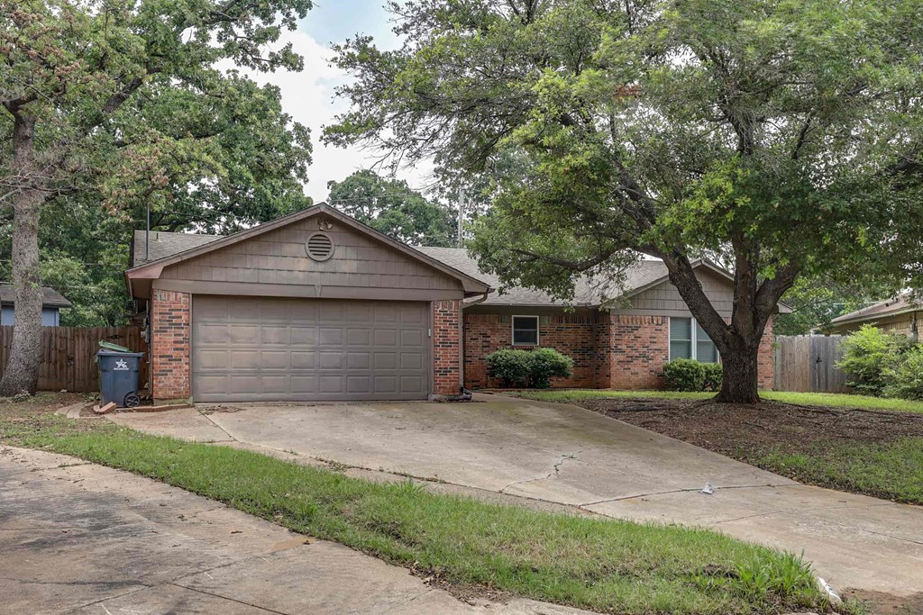 a house with a driveway and a garage door
