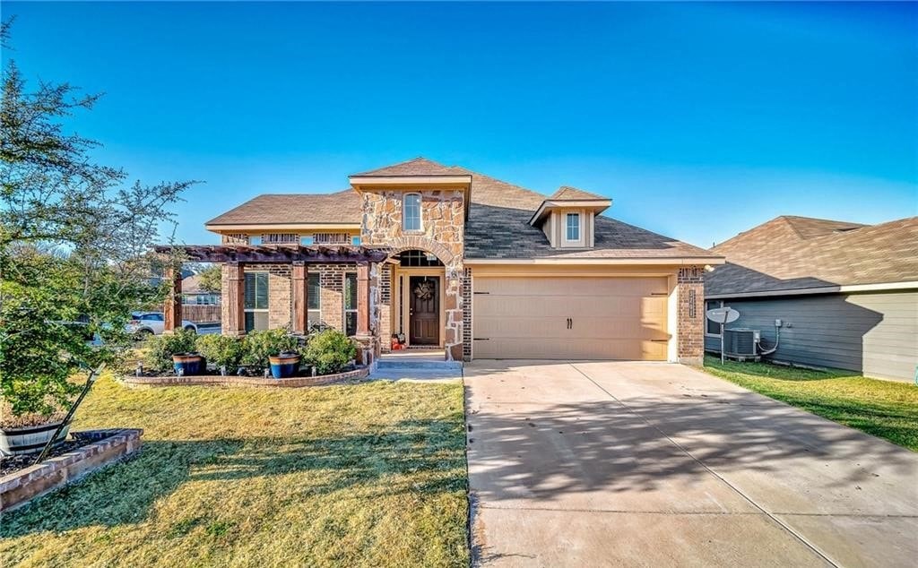 a house with a driveway and a garage door