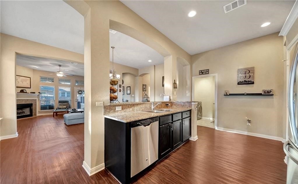 a kitchen and living room with a counter top