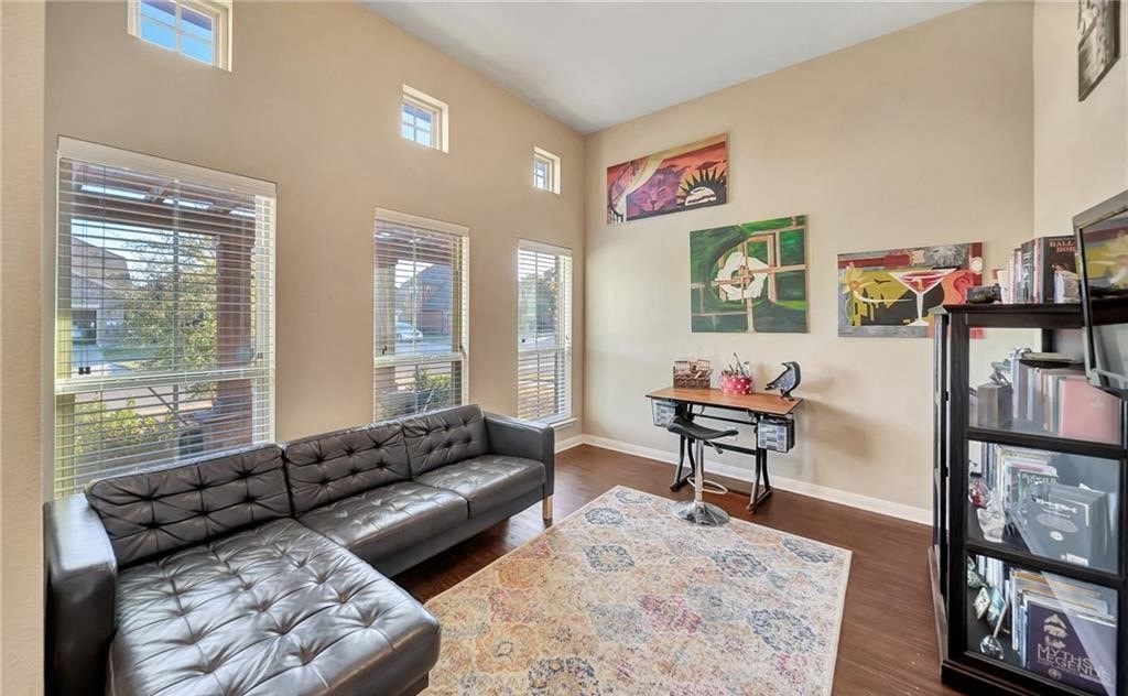 a living room with a couch and a rug