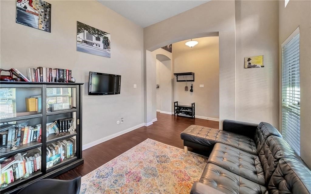a living room with a couch and a tv