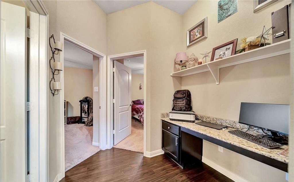 a home office with a desk and a computer