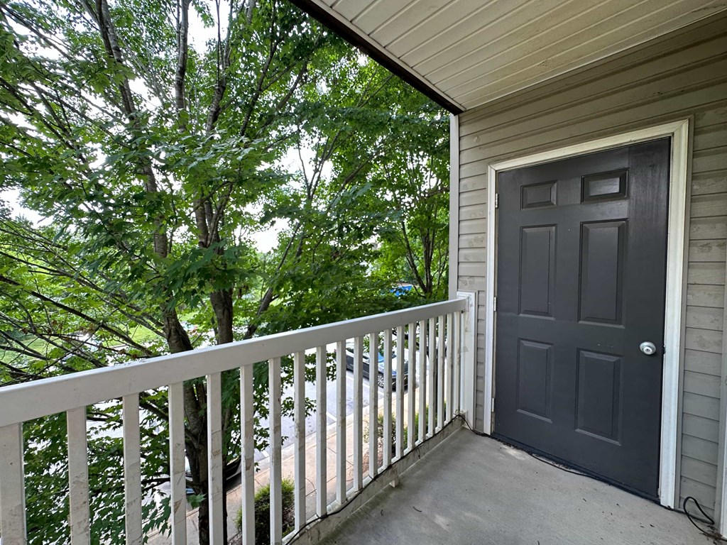 the door to the balcony is open to the lake