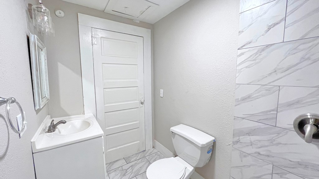 a bathroom with a toilet and a sink