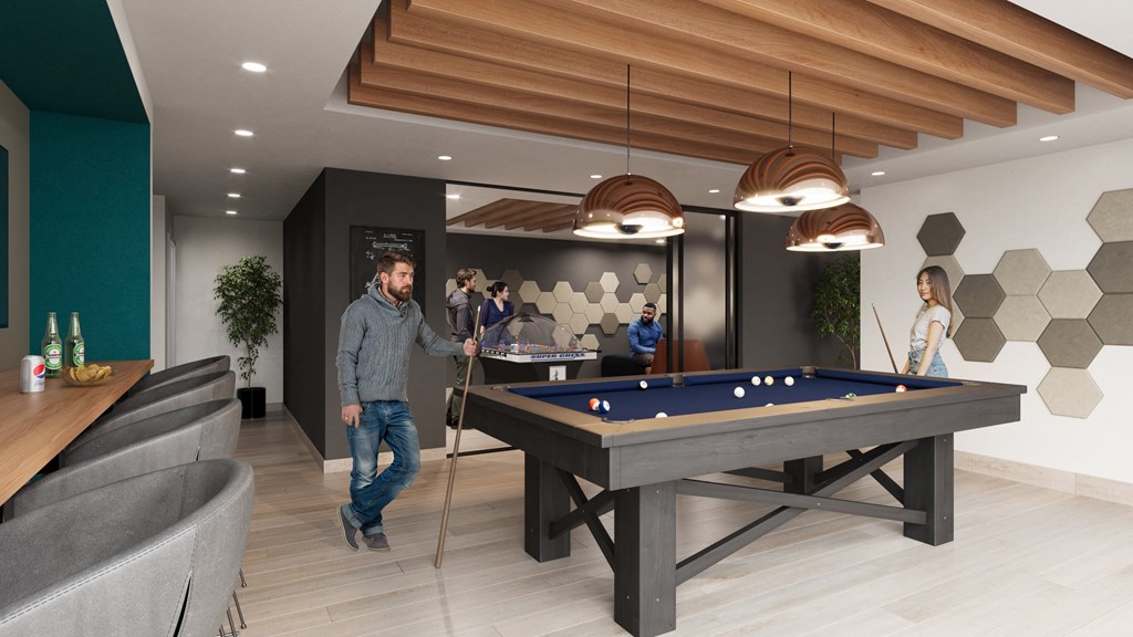 people playing a game of pool in the lobby of an office building