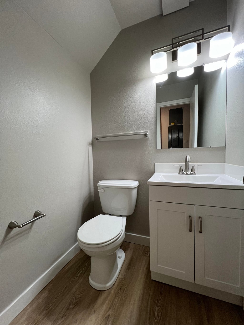 an empty bathroom with a toilet and a sink