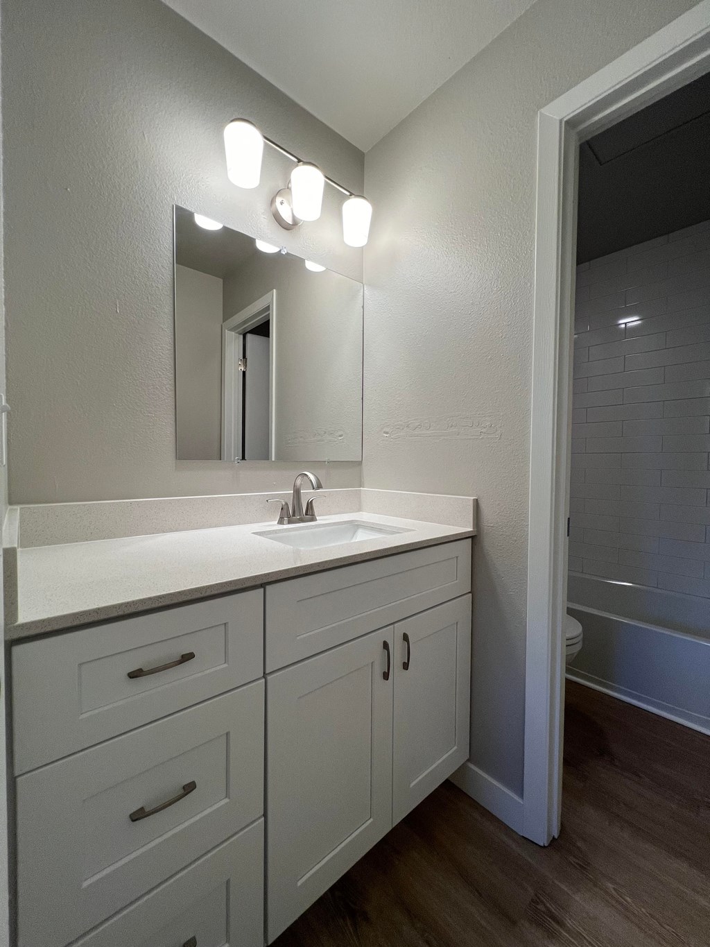 the preserve at ballantyne commons apartment bathroom with sink and mirror