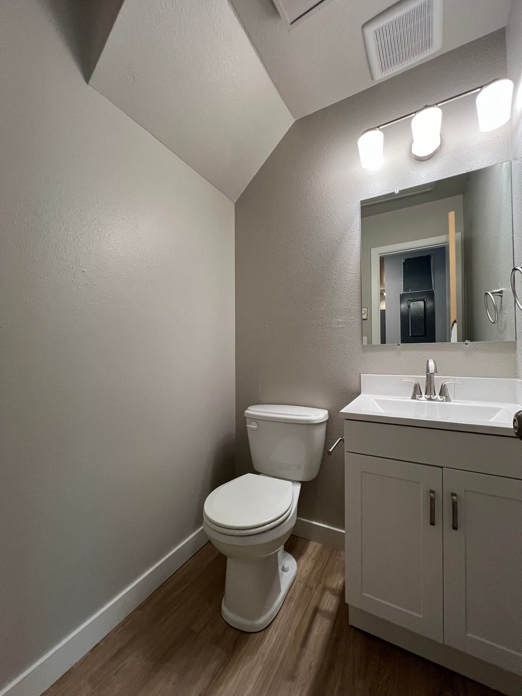 an empty bathroom with a toilet and a sink