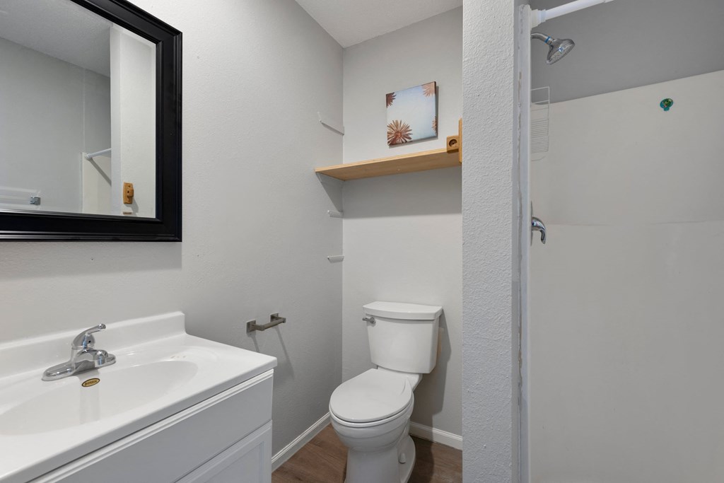 an empty bathroom with a toilet and a sink