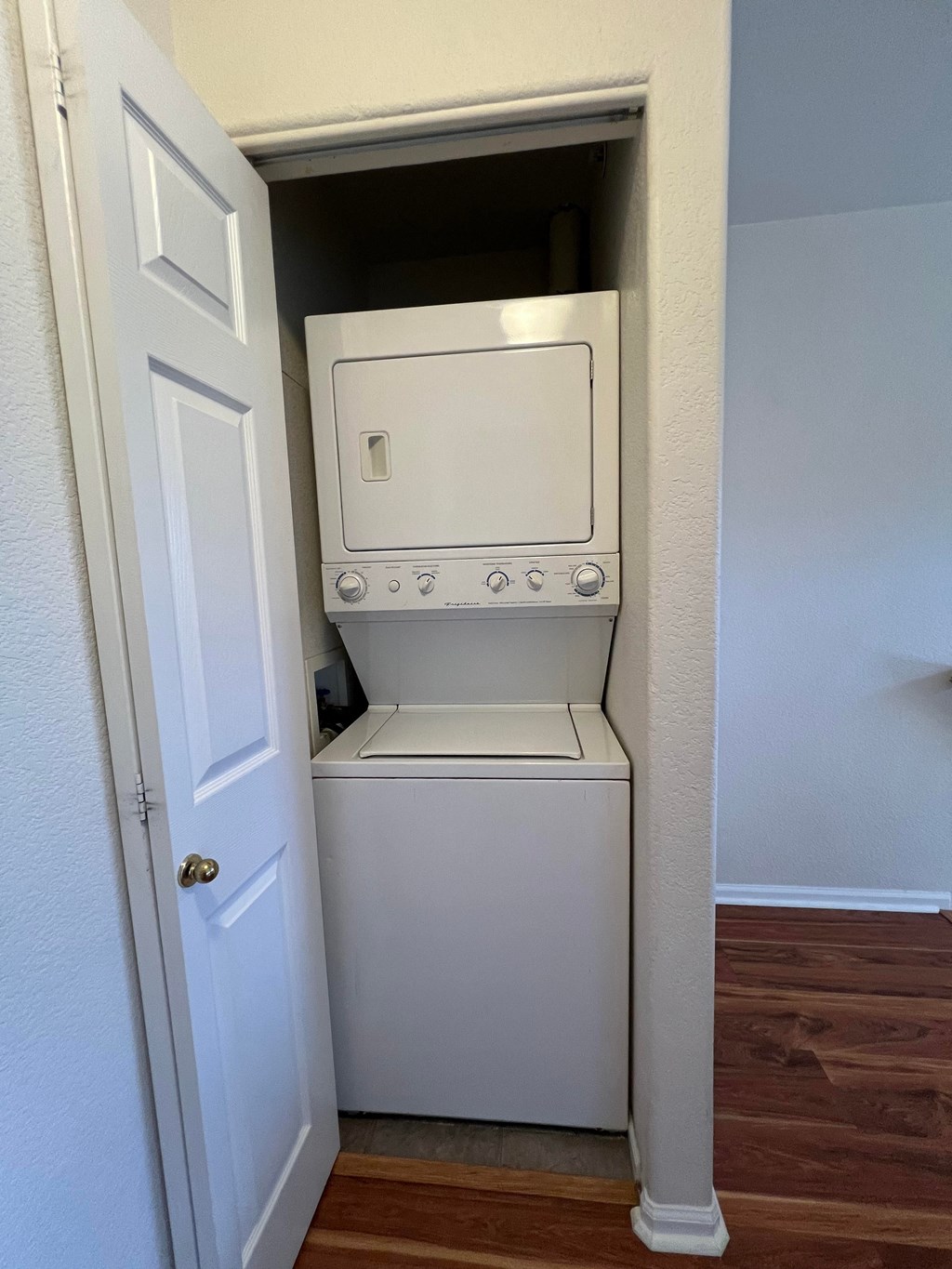 a washer and dryer in a closet in a home