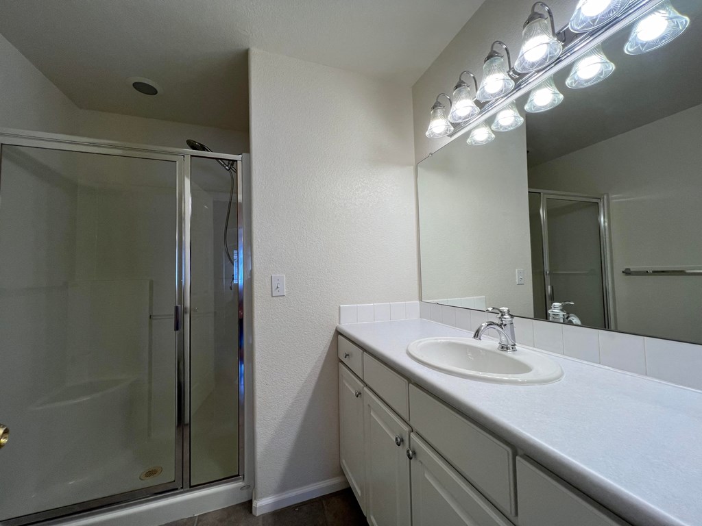 the preserve at ballantyne commons bathroom with sink and shower