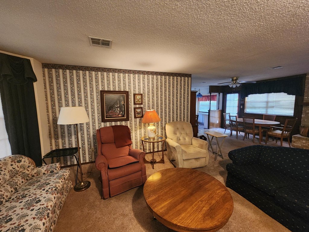a living room filled with furniture and a table