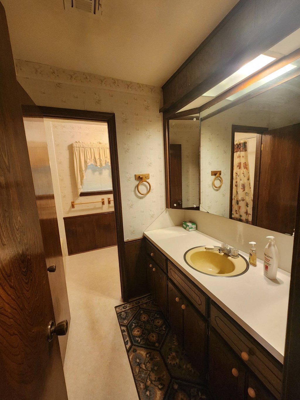 a bathroom with a sink and a mirror