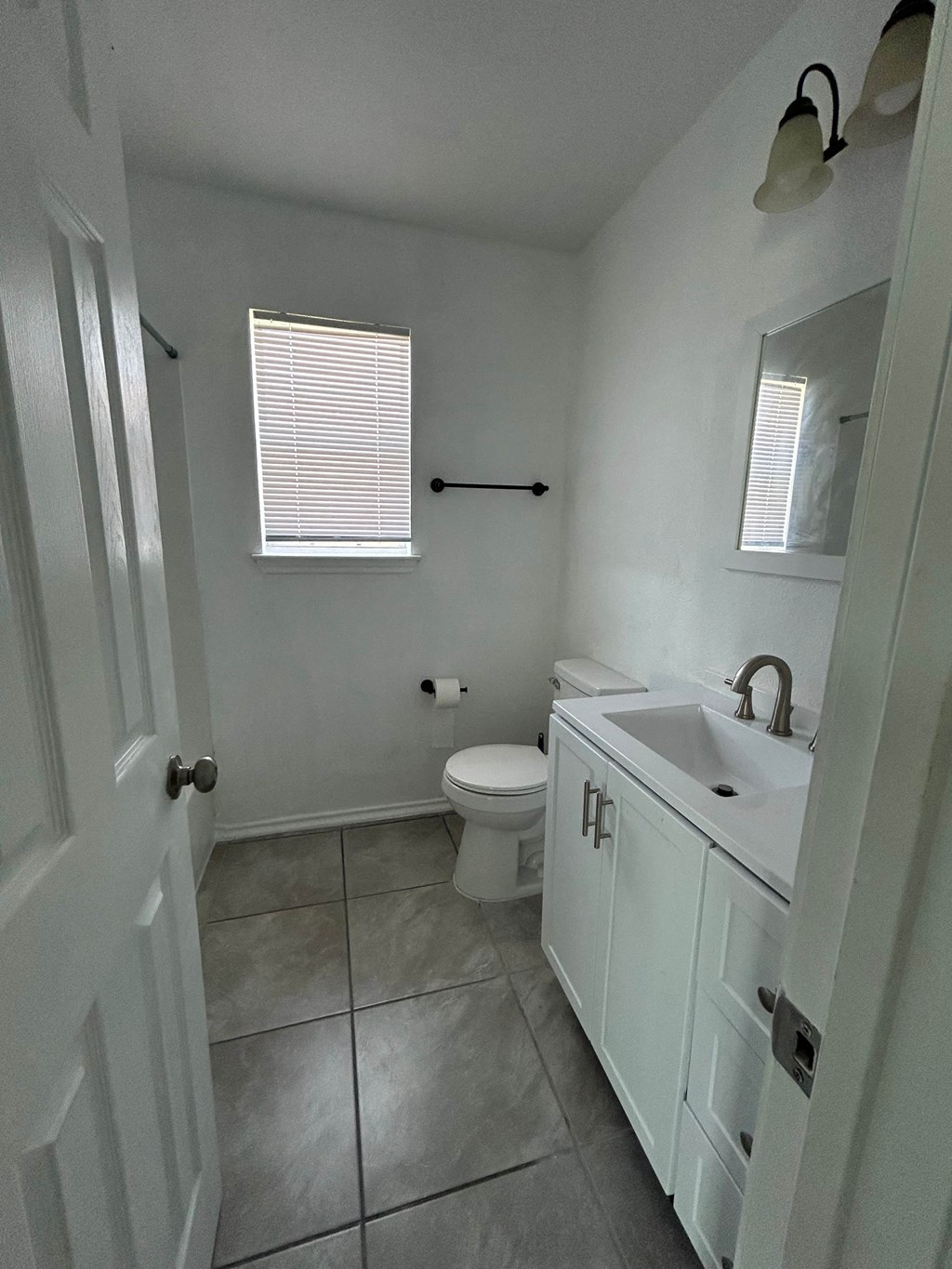 a bathroom with a sink and a toilet