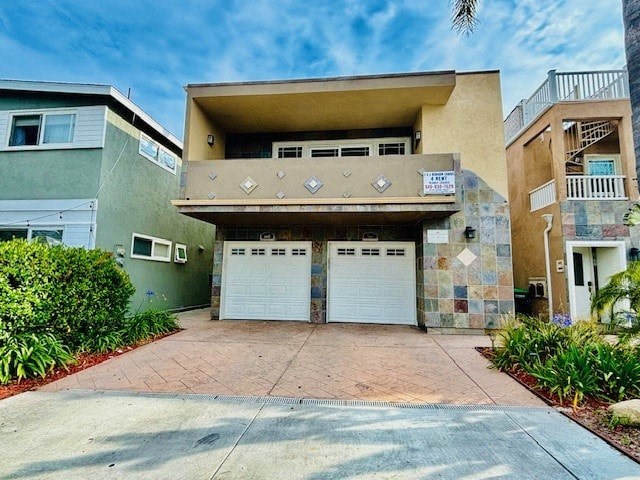 a garage with two doors in front of an apartment building