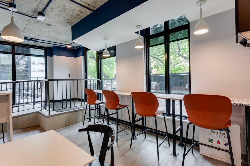 a seating area in a room with a table and chairs