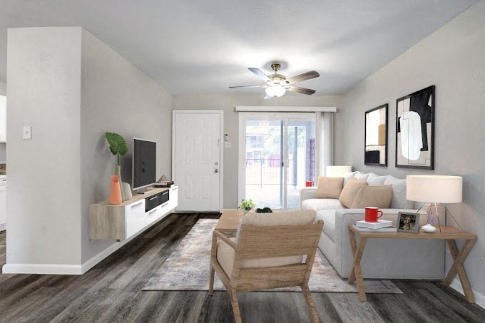 a living room with a couch and a ceiling fan