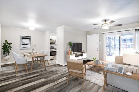 a living room and dining room with a table and chairs
