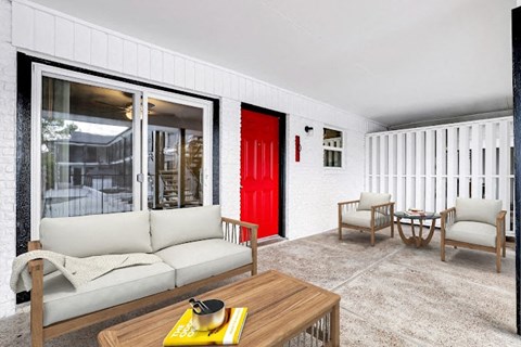 a living room with a red door