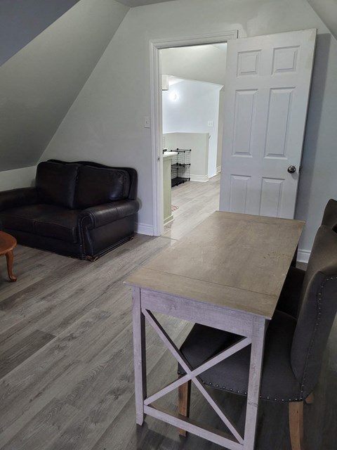 a living room with a table and a couch