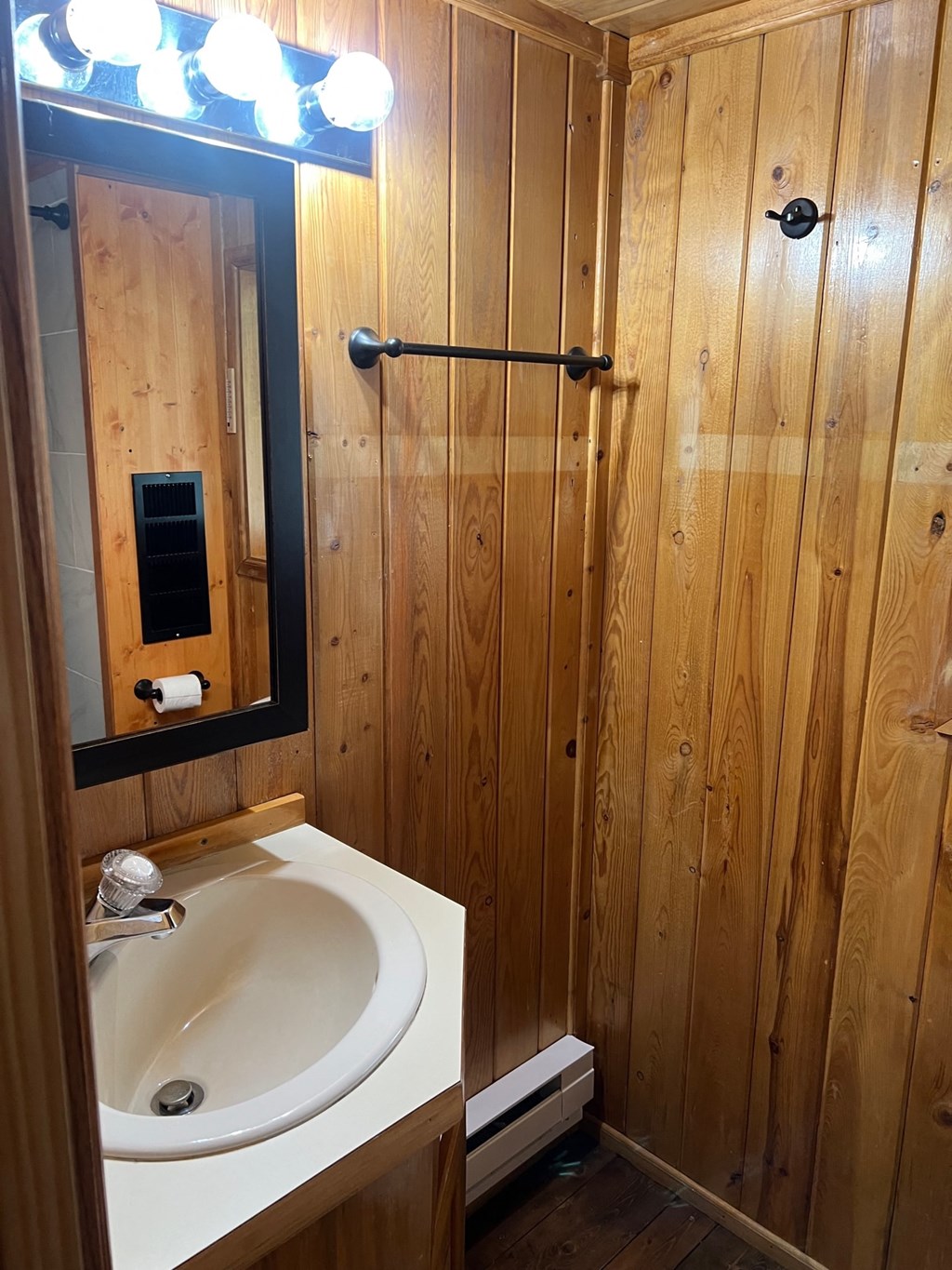 a bathroom with a sink and a mirror