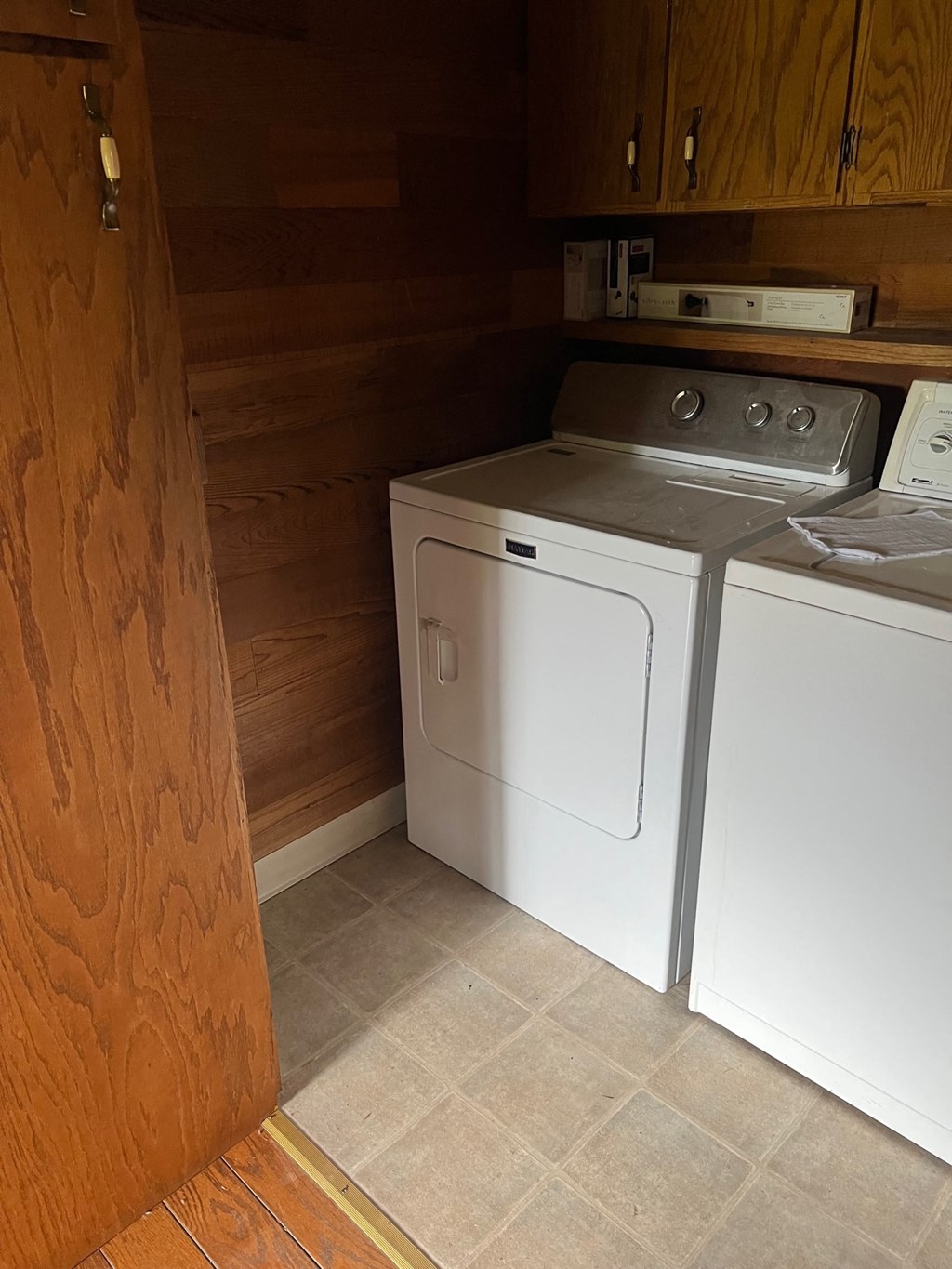 the laundry room has a washer and dryer in it