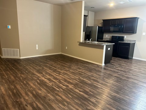 A kitchen area with a counter and appliances.
