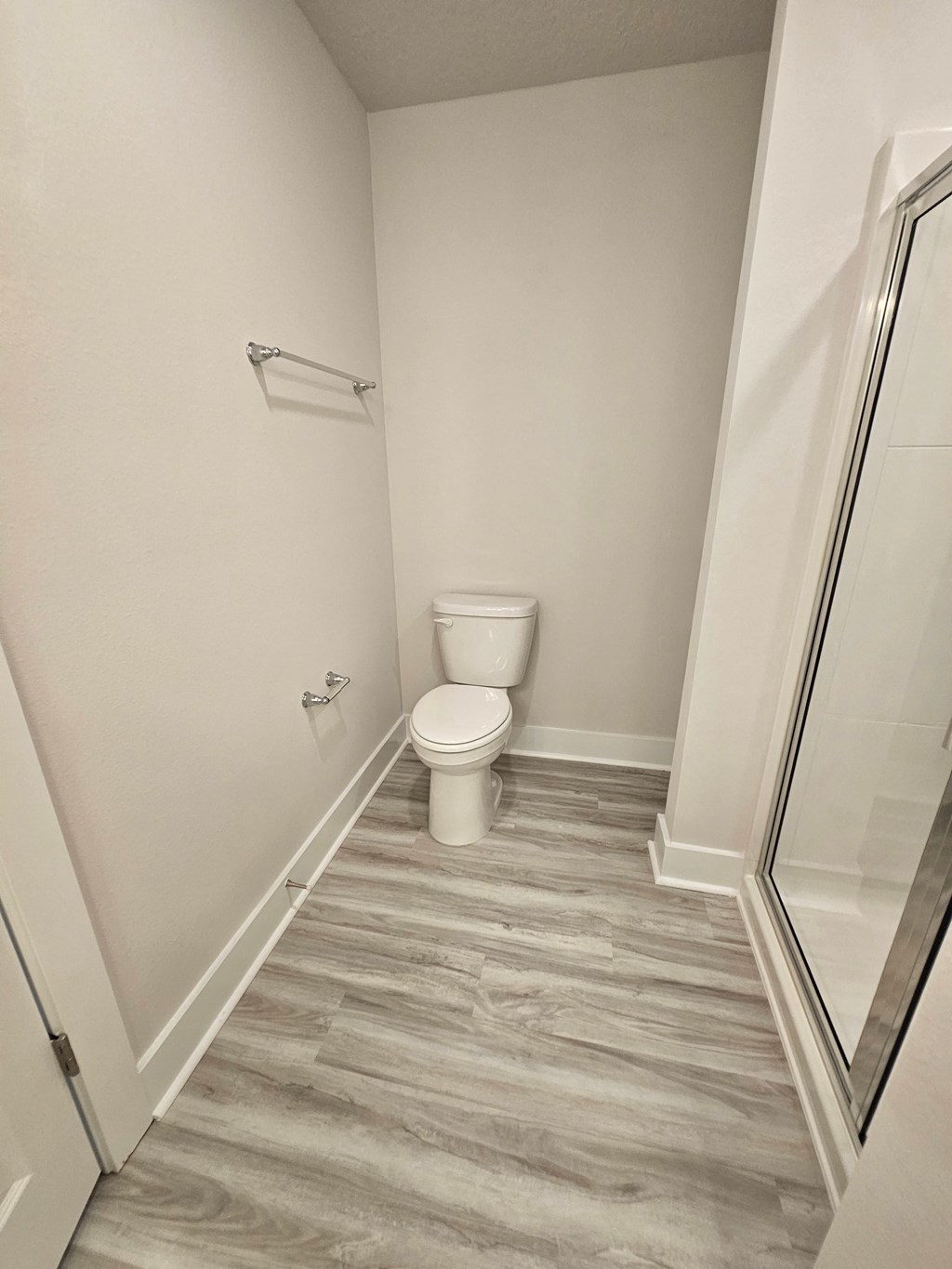 a small bathroom with a toilet and a shower