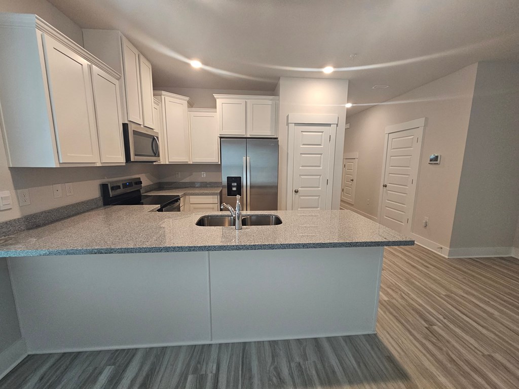 a kitchen with a counter top and a sink