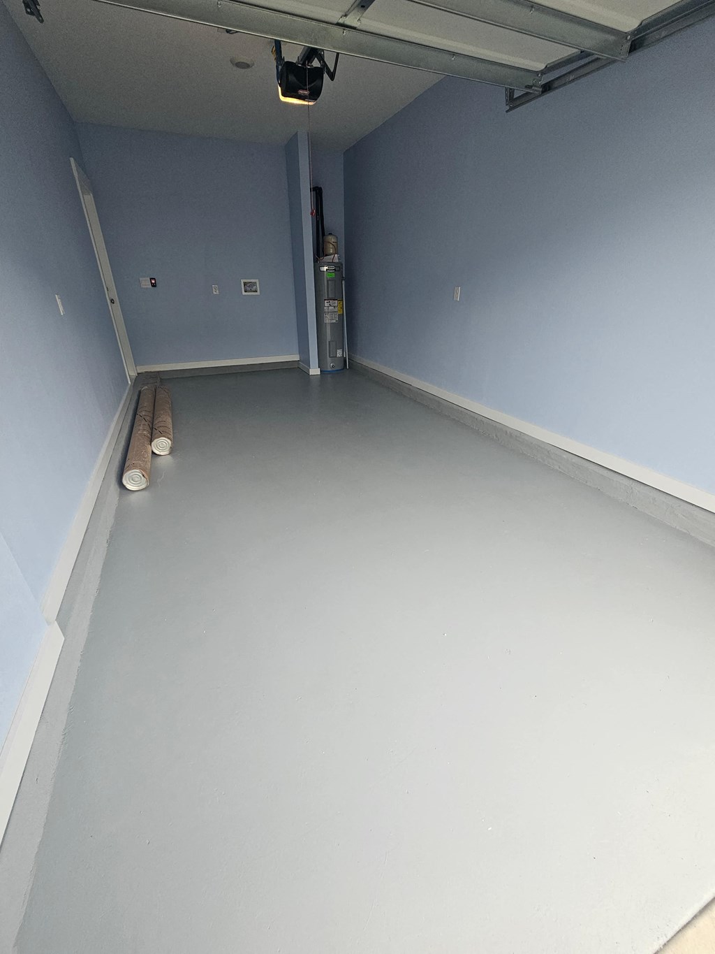 a room with a white floor and blue walls