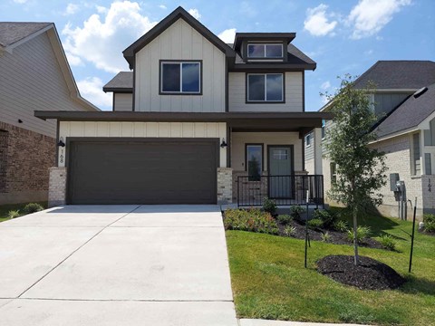 a house with a driveway and a garage door