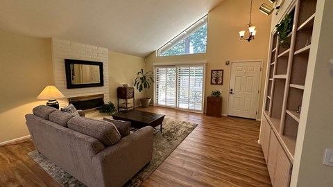 a living room with a couch and a fireplace