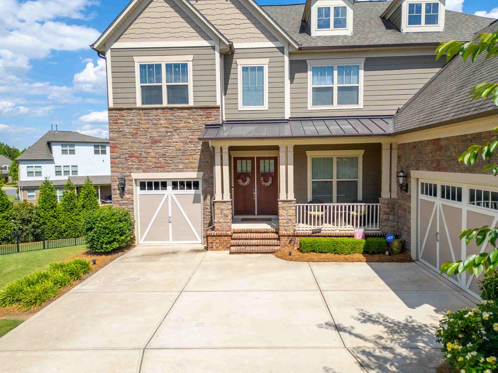 a large house with a driveway in front of it