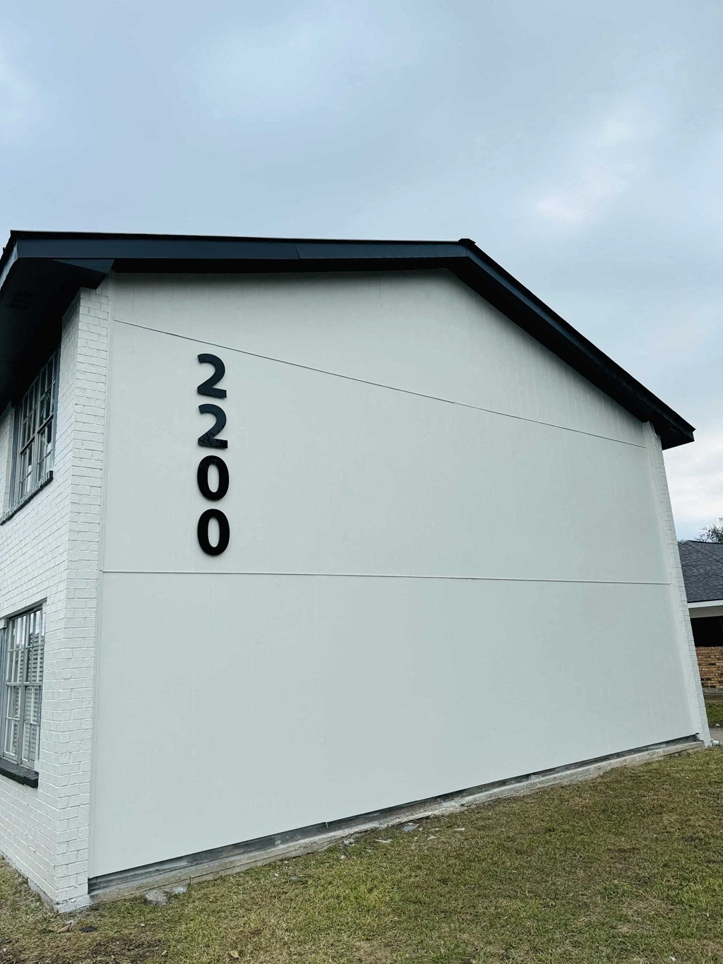 the side of a building with numbers on it