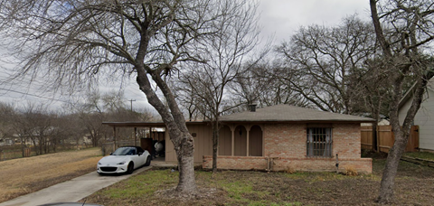 a house with a car parked in front of it