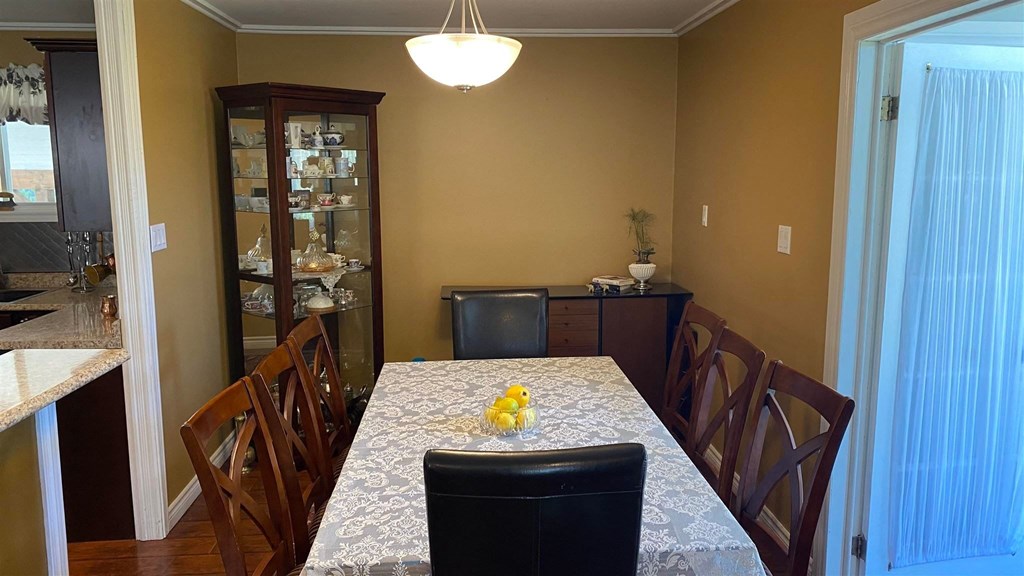 a dining room with a table and chairs