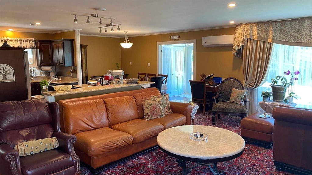 a living room with leather couches and a coffee table