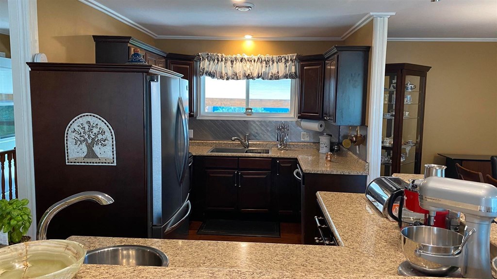 a kitchen with stainless steel appliances and granite counter tops