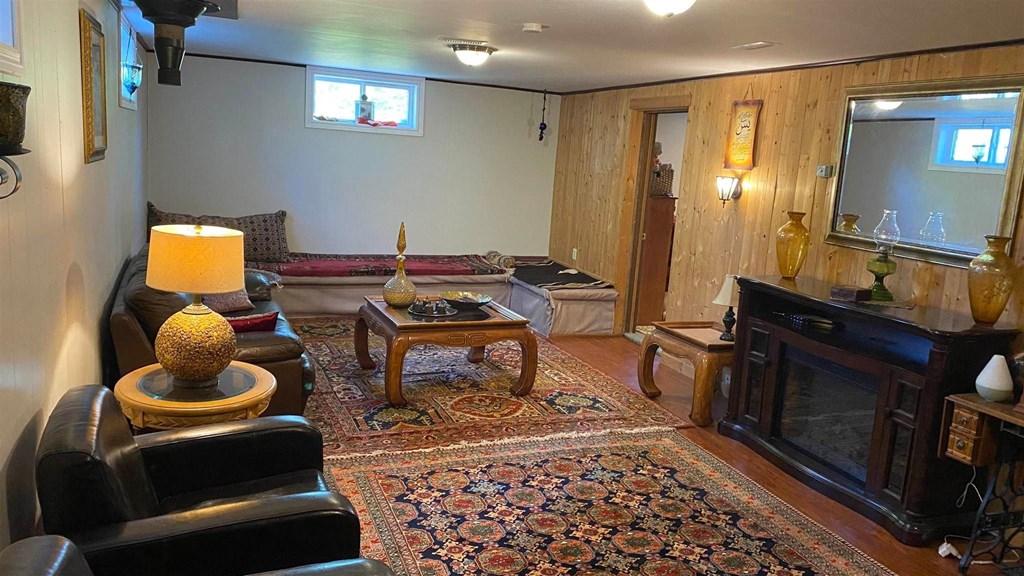 a living room filled with furniture and a fireplace